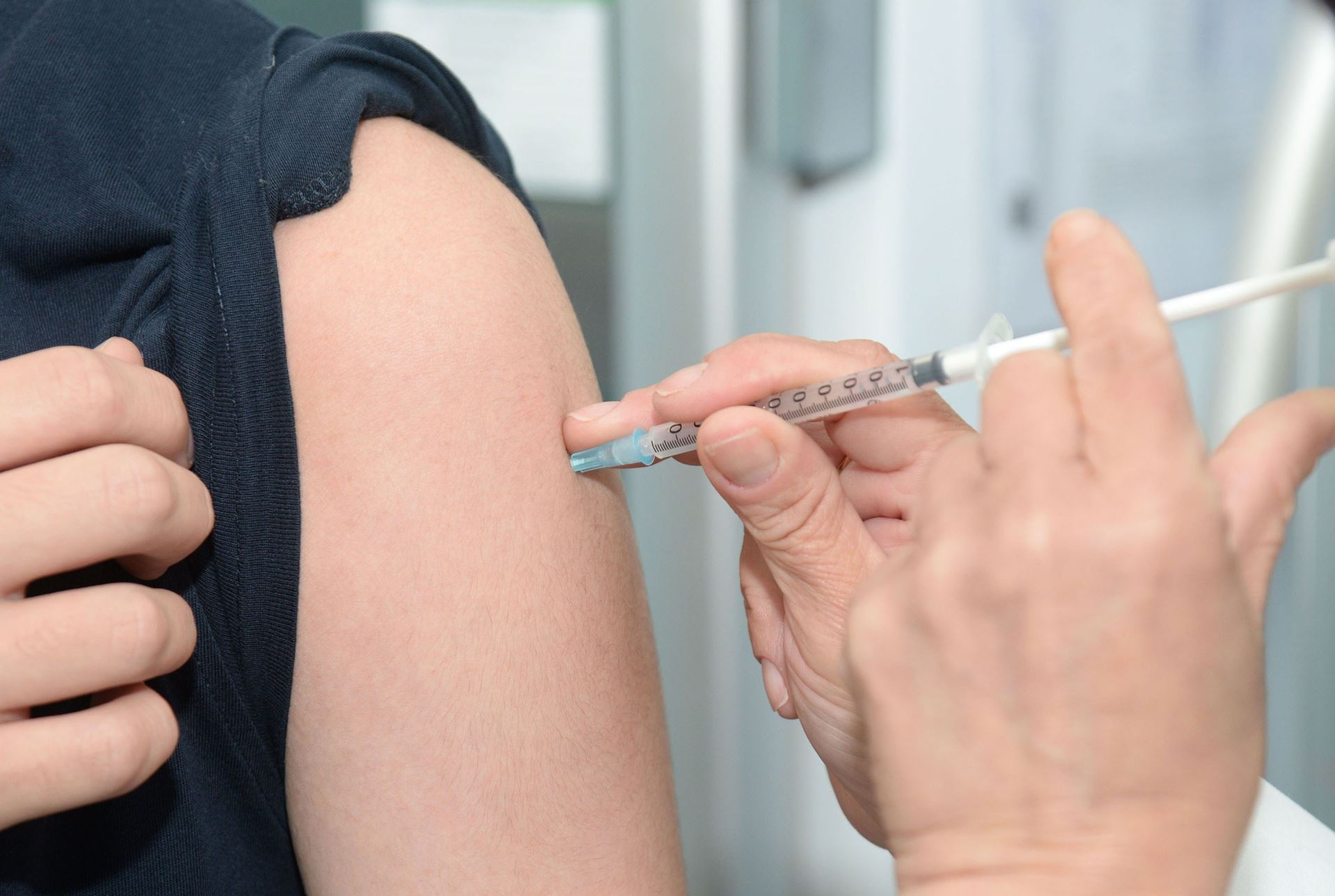 a person having a vaccination
